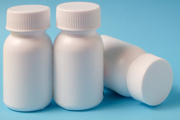 White bottles on blue background