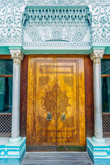 Beautiful carved wooden ornamental door in oriental style
