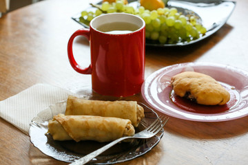 Breakfast-pancakes with meat and tea with lemon