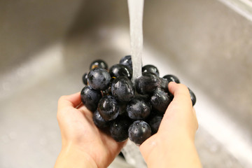 Washing grapes with water