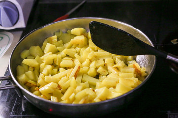 Fried potatoes with sausages
