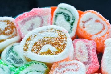 Delicious rolls of Lokum with fruit marmalade jam in japanese style on plate