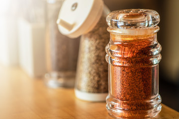 selective focused of set of Japanese seasoning for ramen, chilli, sesame and black pepper