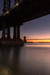 View from under the manhattan bridge at sunset with long exposure