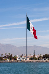 Fototapeta premium large mexican flag in ensenada harbor mexico