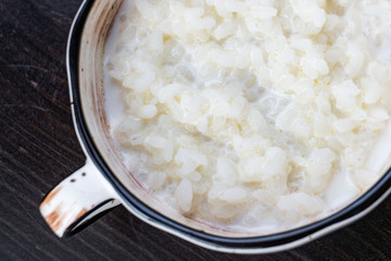 rice pudding in white plate on dark background