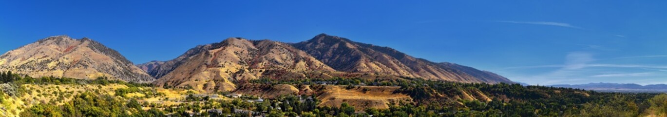 Logan Valley landscape views including Wellsville Mountains, Nibley, Hyrum, Providence and College Ward towns, home of Utah State University, in Cache County a branch of the Wasatch Range of the Rocky - obrazy, fototapety, plakaty