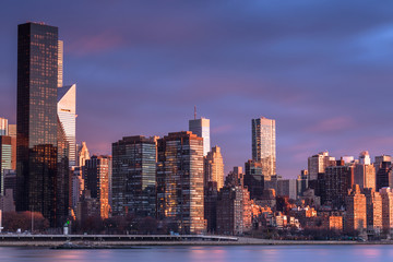 View on Midtown Manhattan  from east river at sunrise with long exposure