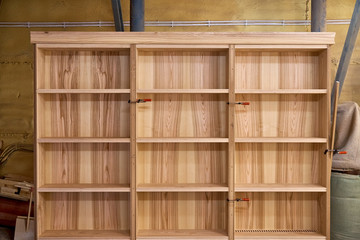 Ash bookshelves. Woodworking and carpentry production. Furniture manufacture.