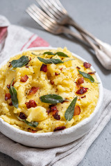 Mashed potatoes with crispy bacon and sage