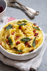 Mashed potatoes with crispy bacon and sage