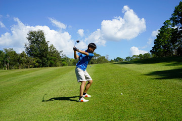Fototapeta premium Golfer playing golf in beautiful golf course in the evening golf course with sunshine in thailand