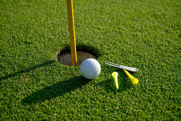 Golf equipment on green grass