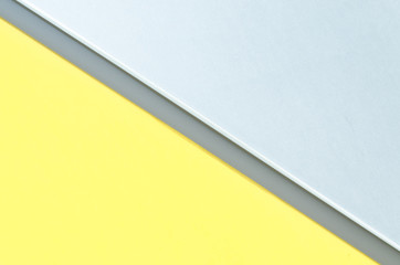 Metal splitted by a line gray yellow color background of modern siding house wall.