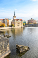 Obraz premium prague river bank and old town at background, czech republic