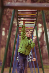 Fototapeta premium Teenager goes in for sports in autumn park