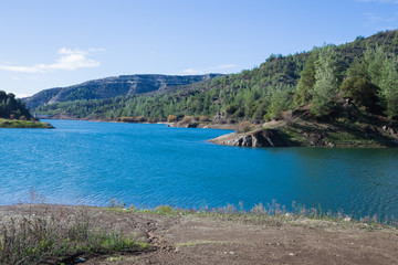 Obraz premium Big hills and blue lake. Travel photo 2018, december.