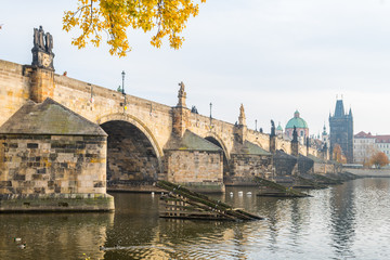prague river bank and old town at background, czech republic
