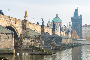prague river bank and old town at background, czech republic