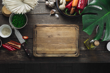 Around empty cutting board raw ingredients kitchen cooking vegetarian thai noodles top view