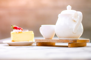 vanilla cake and hot tree on table in relax time.
