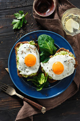 Top view healthy avocado toasts breakfast lunch avocado fried eggs