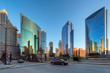 Fototapeta na wymiar Chicago street in Chicago downtown, skyscraper and Chicago bridge at sunset. Chicago, Illinois. 