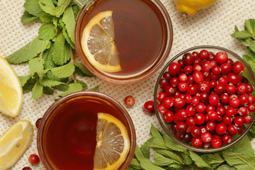 Hot tea with lemons, mint and cranberry	