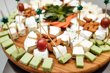 Tasting cheese dish . Delicious cheese on the table. Table setti