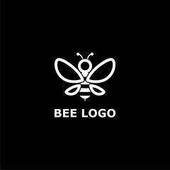 Bee logo for bee or honey business icon on dark background