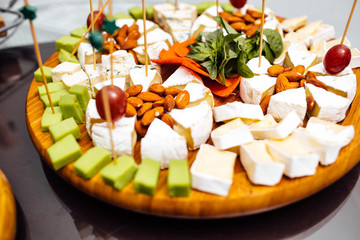 Tasting cheese dish . Delicious cheese on the table. Table setti