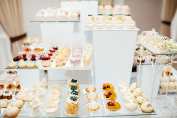 Table with different sweets for party. Candy bar. 