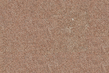 Fragment of painted brown cement stone wall background, seamless tiling texture