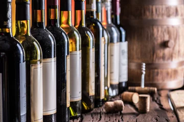 Gordijnen Wine bottles in row and oak wine keg. © volff