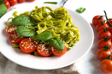 spinach tagliatelle with cherry tomatoes. proper diet.