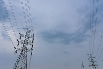 Electricity concept. Close up high voltage power lines station.