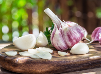 Garlic bulb and garlic cloves  on the wooden table.