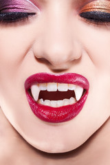 Obraz premium Sexy vampire. Women's lips with red lipstick.
