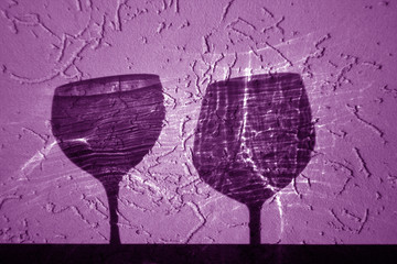 Two wine glasses shadow in purple tone.
