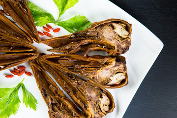 Duck head with sauce