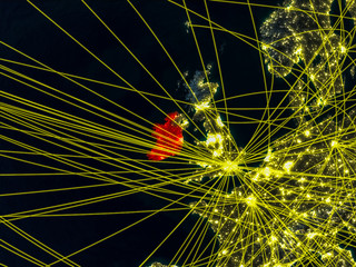 Ireland from space on model of planet Earth at night with networks. Detailed planet surface with city lights.