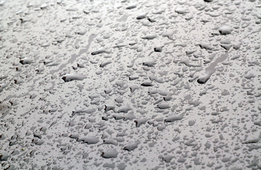 Water drops on car surface.