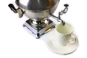 Samovar, Russian national souvenir and white cup on a white background