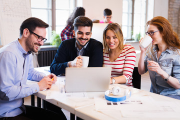 Picture of young architects discussing in office