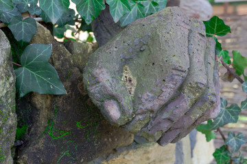 the sculpture of the fingers of hand clenched into a fist