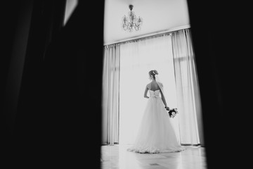 Beautiful fashion bride in wedding dress posing