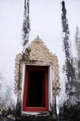 The Thai art stucco of Window frame isolate with white color. It make since 100 year ago