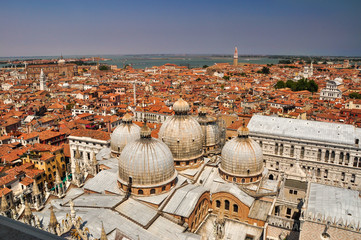 Fototapeta na wymiar The view from the height of the sea, neighborhood and rooftops of the city of Venice