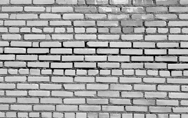 Brick wall surface in black and white.