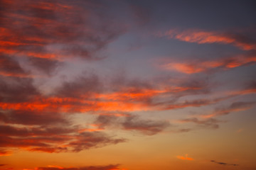 Beautiful bright colorful sky. Picture taken at sunset. Red-orange background with nice paints. Rare sunrise. Natural composition